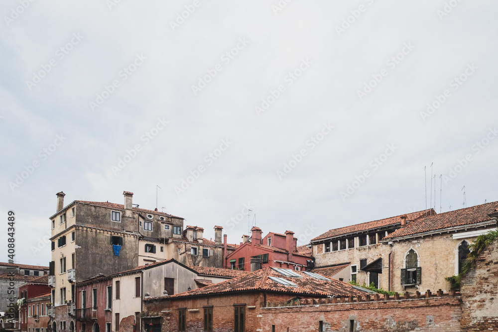 Houses under cloudy sky in Venice, Italy