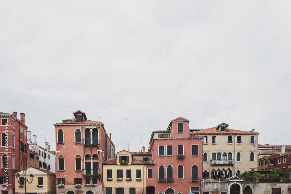Houses under cloudy sky in Venice, Italy