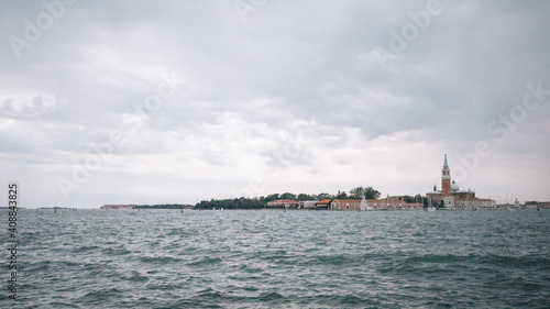 Landscape of lagoon and island of San Giorgio Maggiore under cloudy sky, Venice, Italy © Mark Zhu