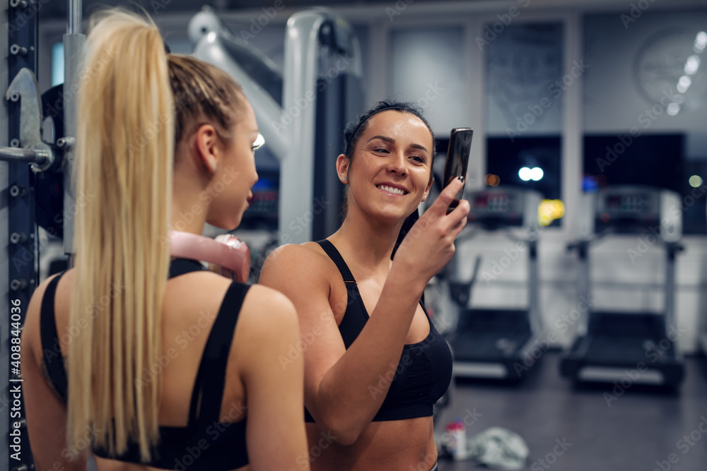 Portrait of young women taking a selfie in the gym Portrait of young women taking a selfie in the gym