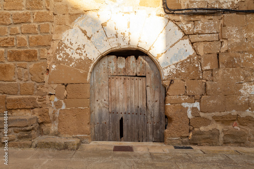 Door and house from medieval times, in the town of Sadaba, in the Cinco Villas region, in the province of Zaragoza, Aragon, Spain. photo