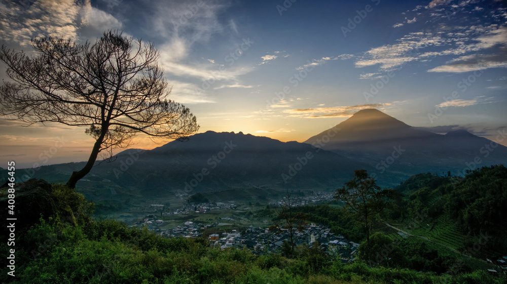 Panoramic sunrise on the mountains located at the Tieng Viewpoint, Wonosobo Regency, Indonesia.