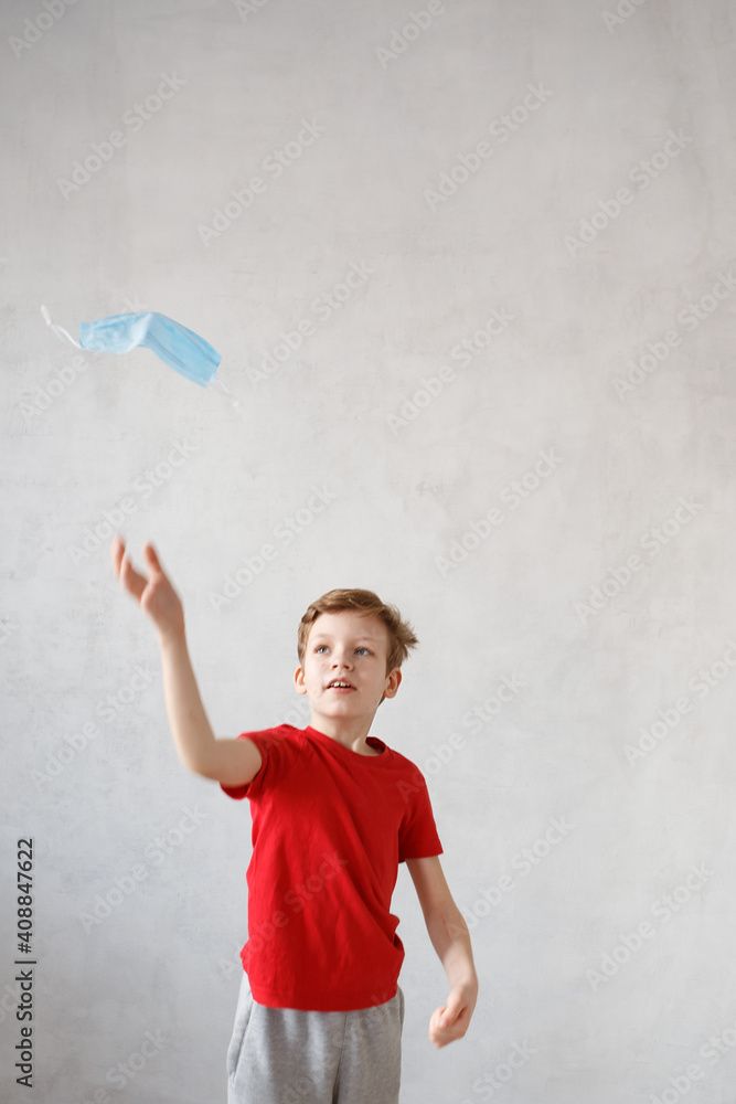 Little boy wearing a mask against corona virus covid-19, 2019-nCov. Kid in a surgical bandage or respirator during corona virus and flu outbreak. Child in a medical mask. quarantine. Little boy wearing a mask against corona virus covid-19, 2019-nCov. Kid in a surgical bandage or respirator during corona virus and flu outbreak. Child in a medical mask. quarantine.