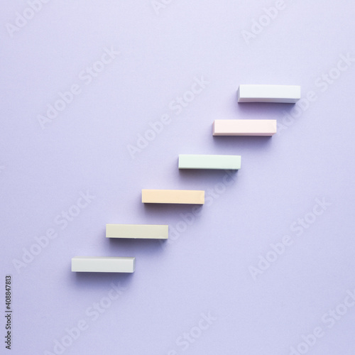 Stairs block on purple background. Growth and challenge concept