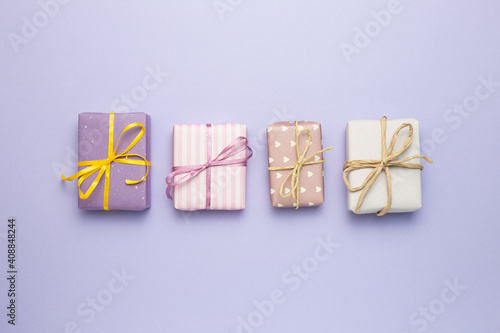 Obraz na płótnie Purple gift boxes on purple background. flat lay, top view, copy space w salonie