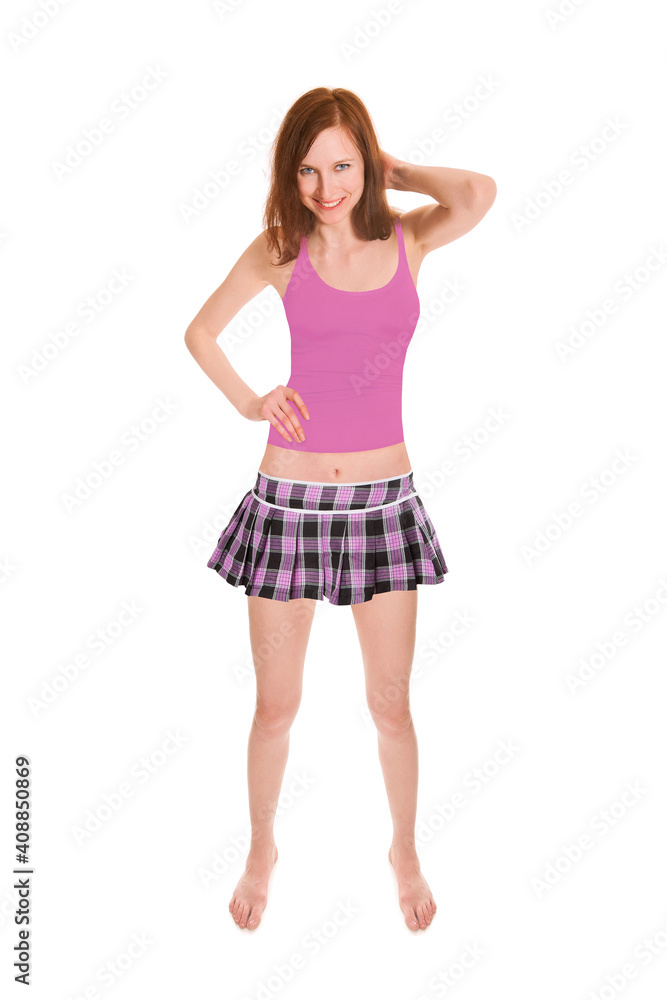 Full length portrait of an attractive laughing woman wearing a pink miniskirt and tank top, isolated on white studio background Full length portrait of an attractive laughing woman wearing a pink miniskirt and tank top, isolated on white studio background