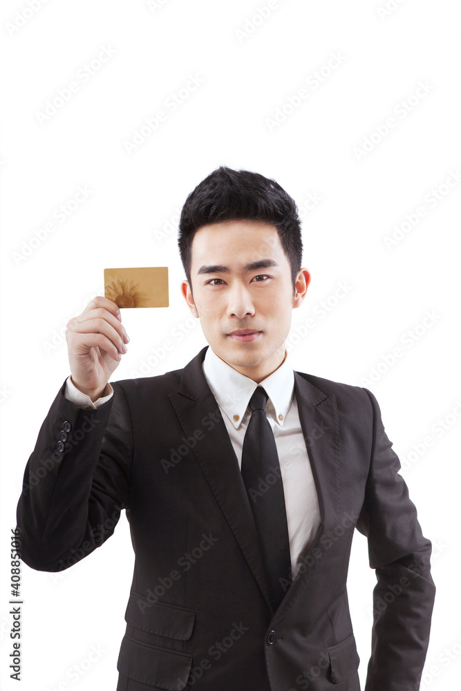 Business people holding a credit card Business people holding a credit card