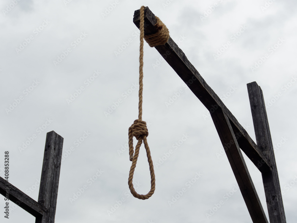 The gallows against the dark sky. Medieval execution. Depression. The gallows against the dark sky. Medieval execution. Depression.
