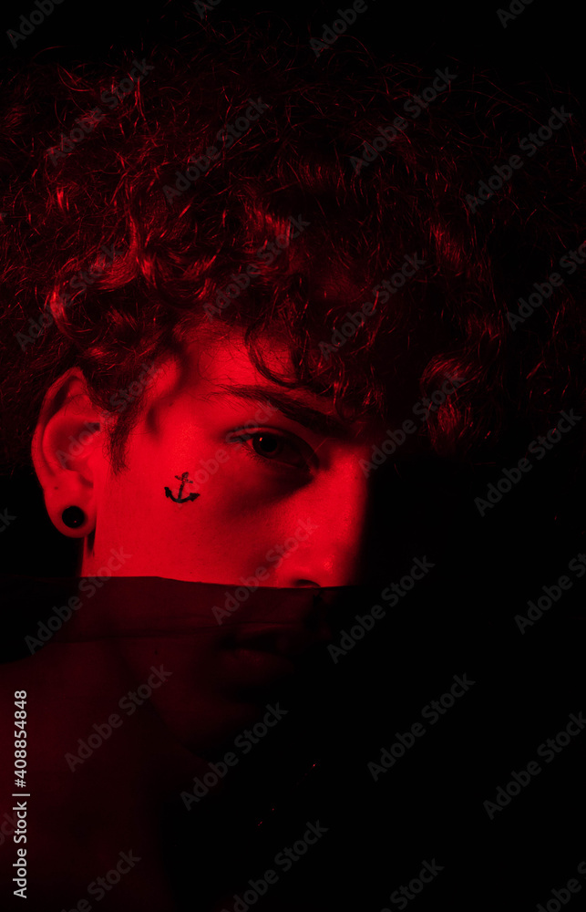 portrait of curly man looking at camera
portrait of curly man looking at camera