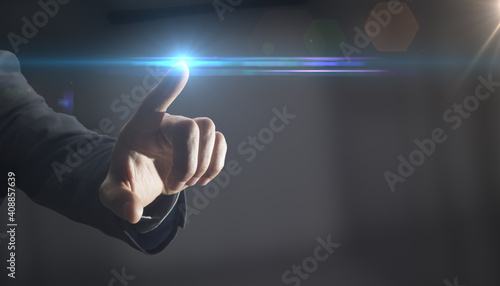 Bild auf Leinwand The hand of a man in a suit rolls with the finger of an invisible point