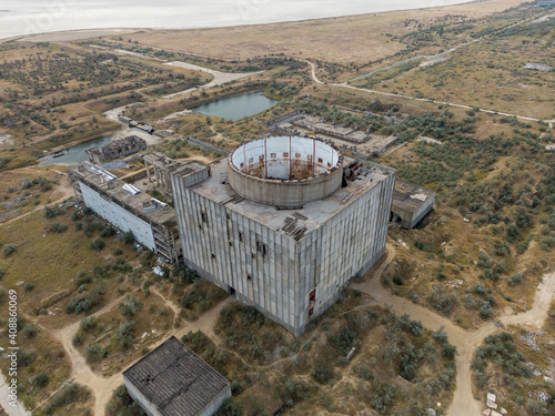 AERIAL SHOT CRIMEA near SHELKINO city AUGUST 2019 Old abandoned atomic power station from soviet union times photo