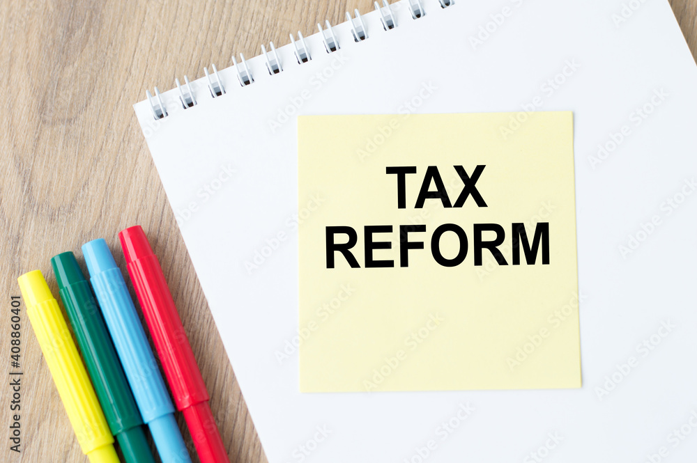 Tax Reform text on paper on your desktop. Business concept for Government Change in Taxes written on sticky note paper Tax Reform text on paper on your desktop. Business concept for Government Change in Taxes written on sticky note paper
