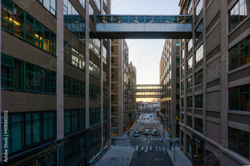 New York, USA - January 21, 2021: Building connected by sky bridge in Dumbo, Brooklyn. Street separating buildings