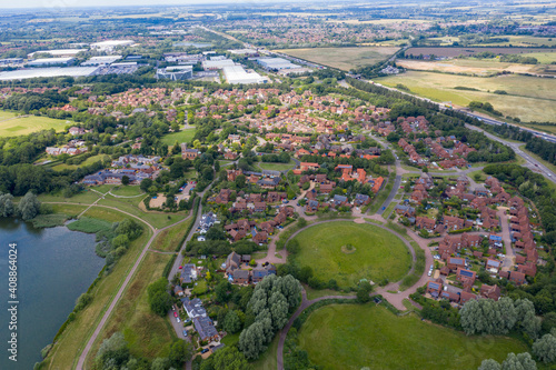Obraz na płótnie Aerial photo of the village of Milton Keynes in the UK showing a typical British housing estate on a sunny summers day taken with a drone from above w salonie