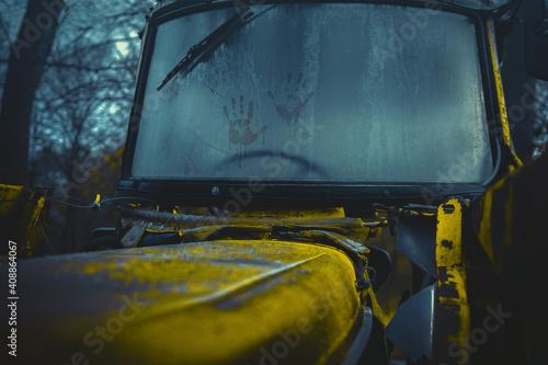 An old rusty tractor from the front