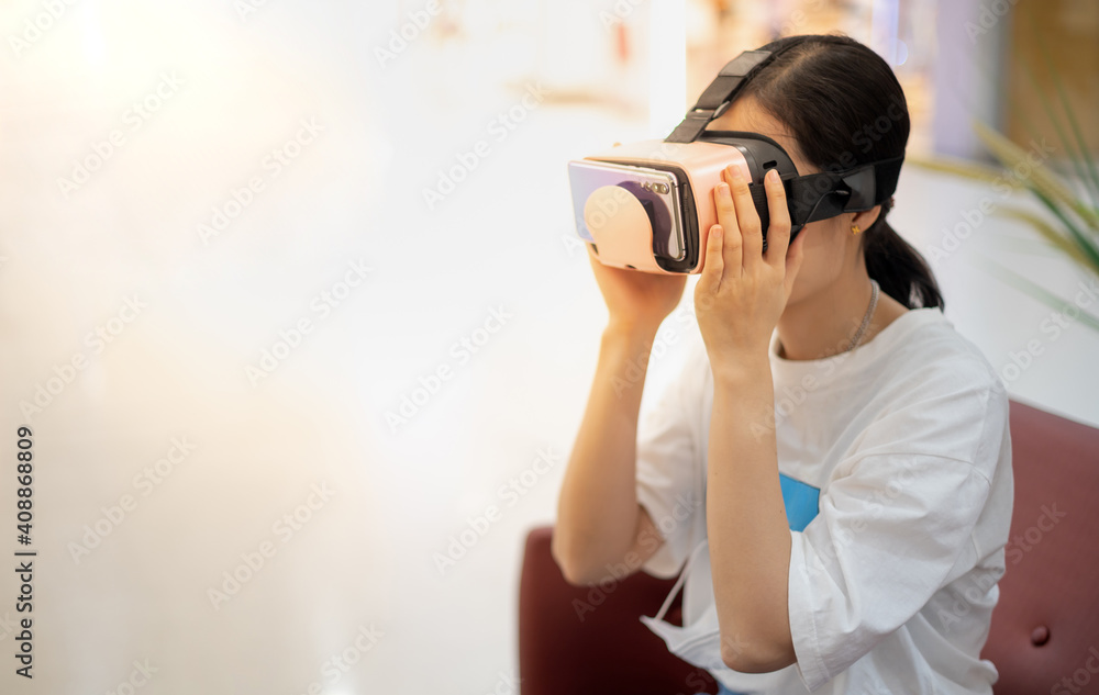 Female wearing virtual reality glasses in modern interior design coworking studio.