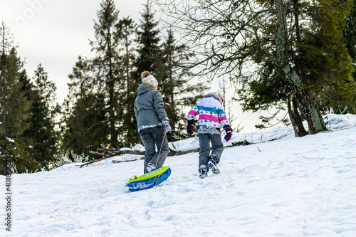 Sledding on Nord-East slopes of Polonina Borzhava, Carpathian mountains in Izki, Ukraine on January 3, 2021. 