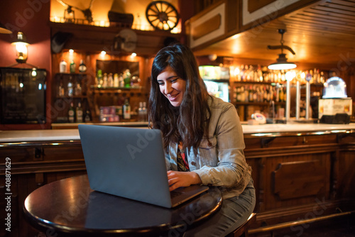 Businesswoman working with her a computer in a coffee shop