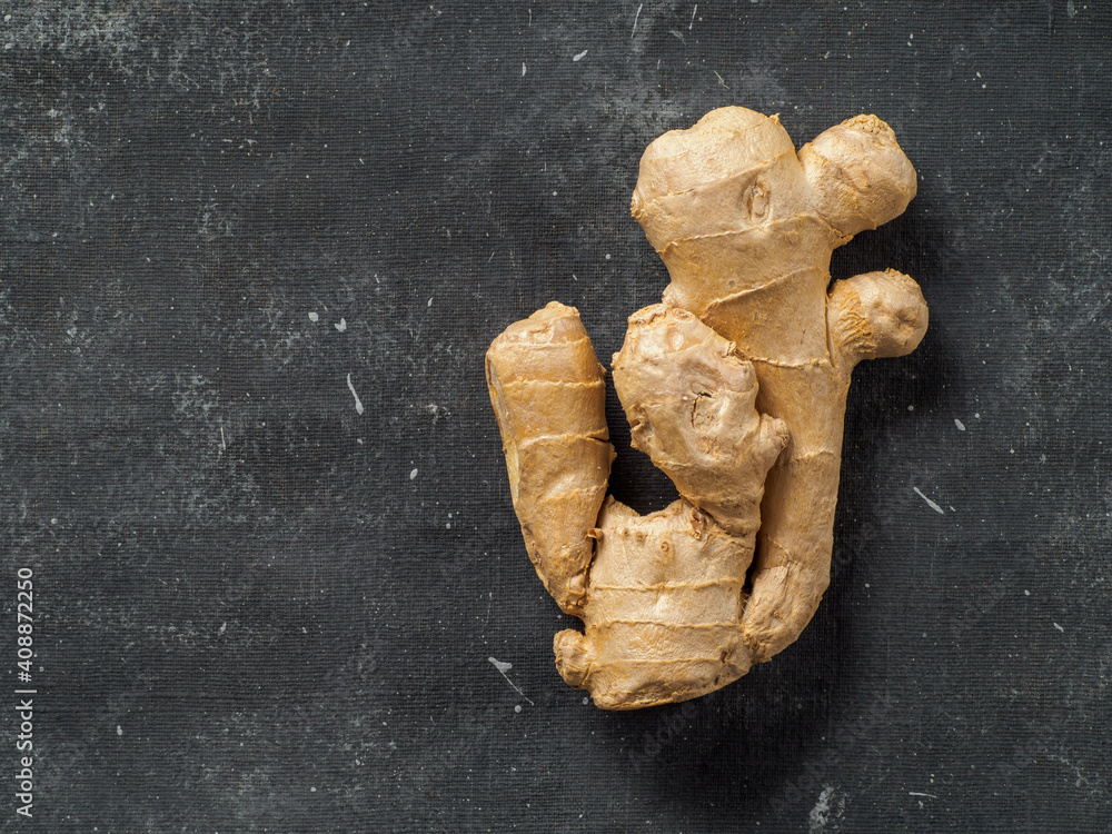 Ginger root on dark background. Ginger root on dark background.