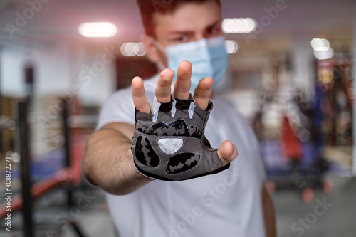 Trainer showing prohibition hand gesture .