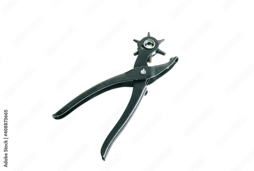 A dress making and crafting hole punch isolated on a plain white background A dress making and crafting hole punch isolated on a plain white background