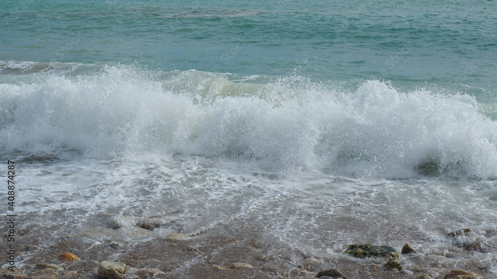 Mediterranean rocky beach with wavy sea in a cloudy morning Mediterranean rocky beach with wavy sea in a cloudy morning