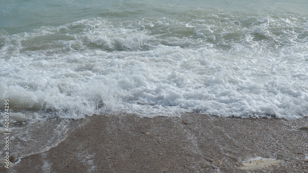 Mediterranean rocky beach with wavy sea in a cloudy morning Mediterranean rocky beach with wavy sea in a cloudy morning