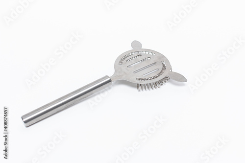 Slika na platnu Closeup shot of a stainless steel cocktail strainer isolated on a white backgrou