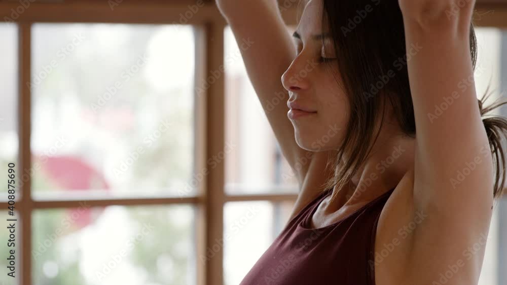 Young woman performing prayer pose in yoga - close up on face Young woman performing prayer pose in yoga - close up on face