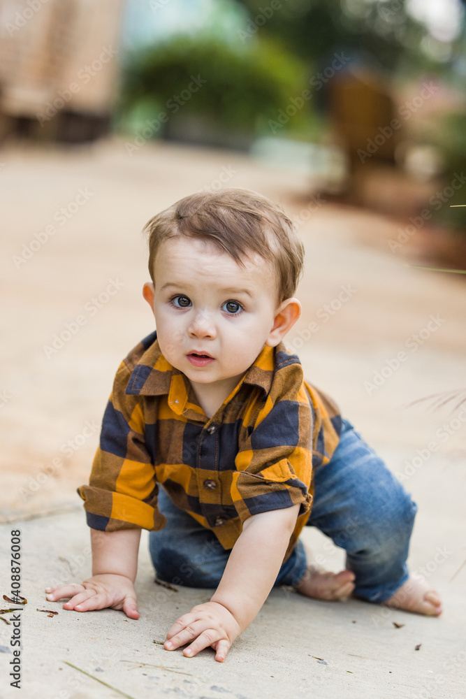 A baby boy eleven months old outdoors in the winter in a downtown setting. A baby boy eleven months old outdoors in the winter in a downtown setting.
