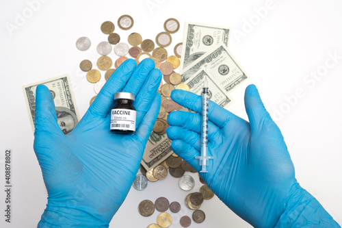 Coronavirus vaccine cost. vaccine ampoule and money. Fight against Covid-19. Pevention, immunization and treatment photo