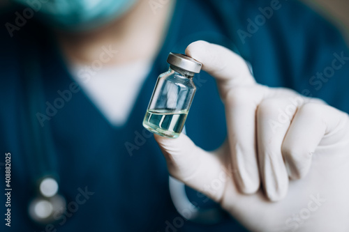Vaccination against covid. The doctor holds a vaccine in his hand. Coronavirus. Vaccine.