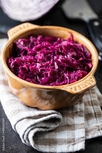 Red sauerkraut. Sour pickled cabbage in bowl.