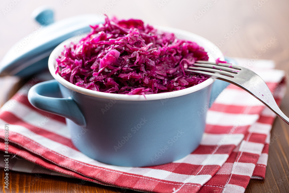 Red sauerkraut. Sour pickled cabbage in blue pot. Red sauerkraut. Sour pickled cabbage in blue pot.
