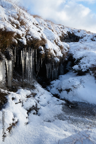 Icicles on a snowy mountainside