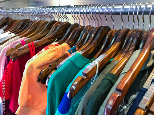 Different women's clothes lined up on the hanger