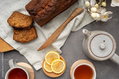 Homemade cake with cups of tea and teapot. Top view. High quality photo