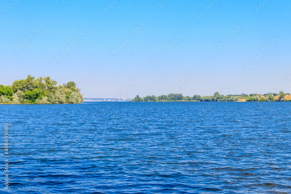 Summer landscape with beautiful river, green trees and blue sky