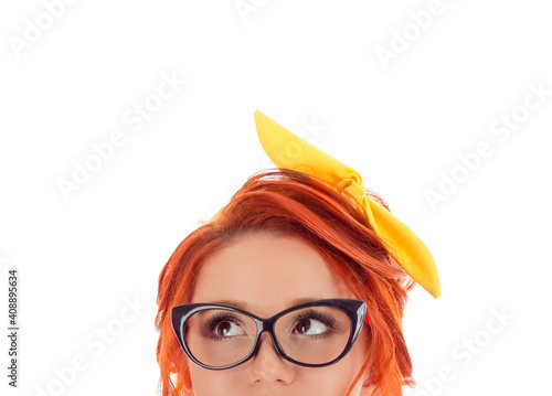 woman looking up thoughtful pensive at copy space