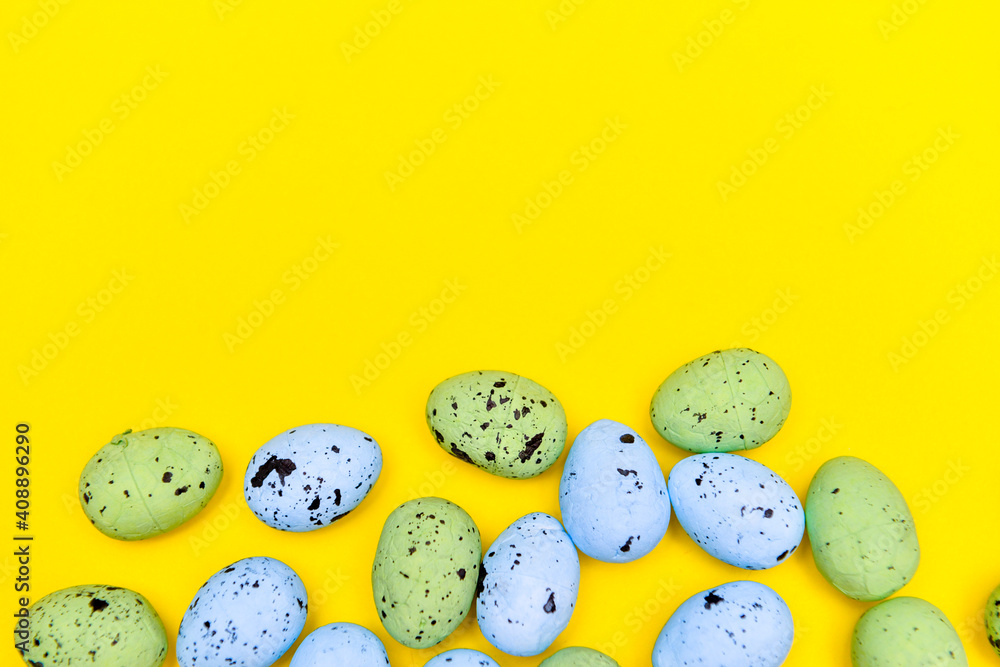 Colorful easter eggs on yellow paper background Colorful easter eggs on yellow paper background