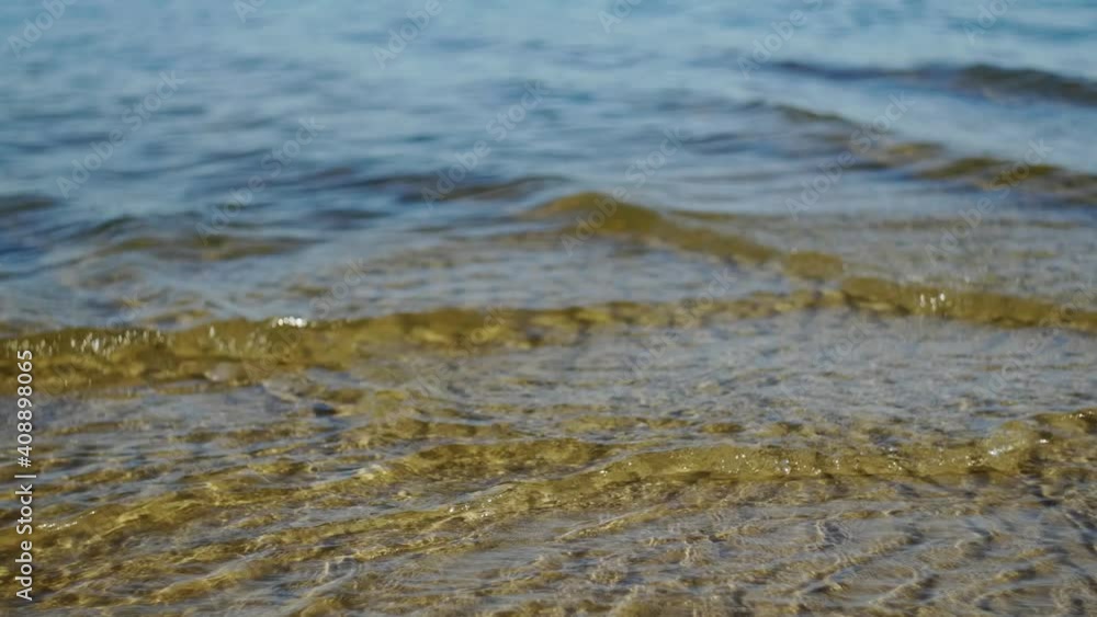 Soft wave on a sandy beach. Close up. Soft wave on a sandy beach. Close up.