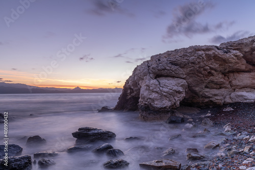 Beautiful sunset over the sea and stone beach of Farinole, Corsica