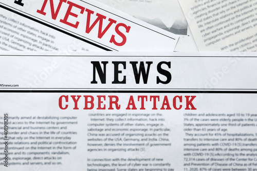 Newspapers with headline Cyber Attack as background, closeup