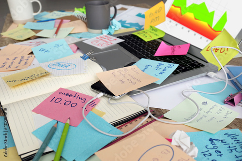 Bild auf Leinwand Laptop, notes and office stationery in mess on desk