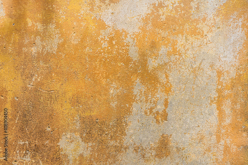 Old, grunge yellow cement, concrete or plaster wall with patterns and cracks. High quality texture and background for your projects and creative work