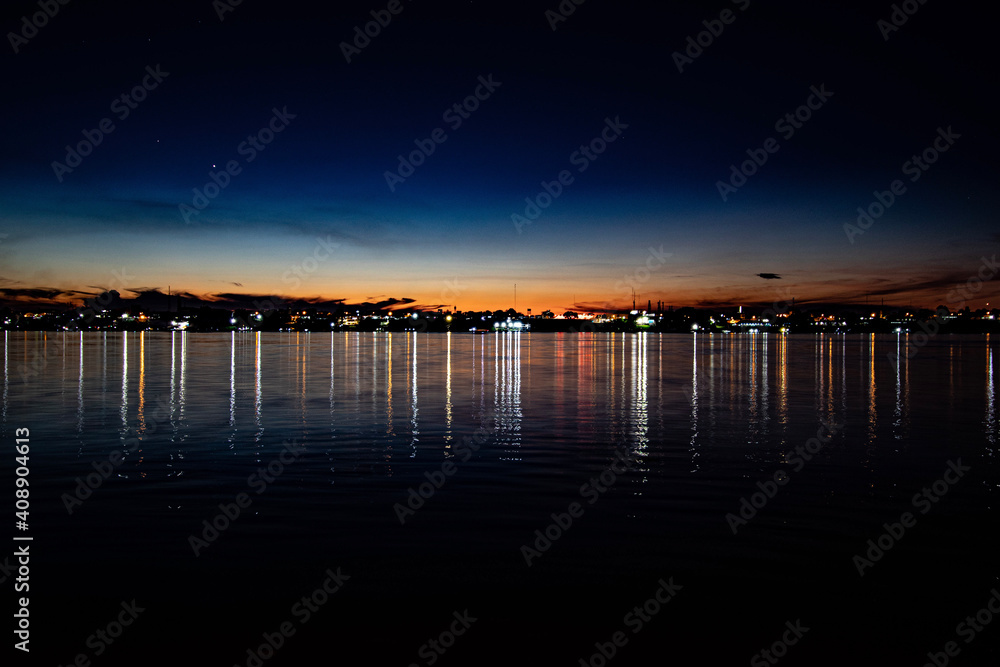 Obraz premium sunset over the river