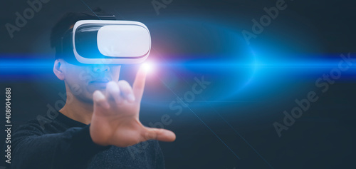 Businessman wearing virtual reality goggles VR and touch in graph Screen of a media screen on the dark background,Technology Process System Business, success and teamwork concept