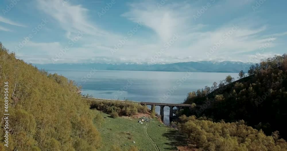 Drone video. Summer. Lake. The mountains. Railway.