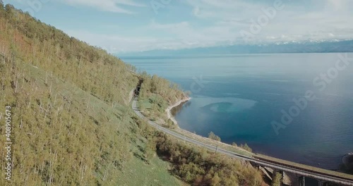 Drone video. Summer. Lake. The mountains. Railway.