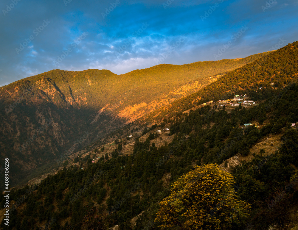 Sunset over the mountains.  Scenic valley in the lap of Himalayan mountain forest, Uttarakhand, India.